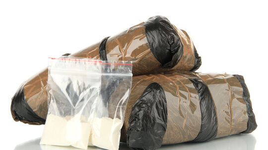 Packages of narcotics isolated on white