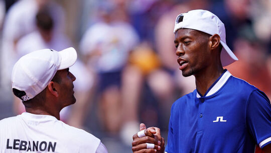 Olympics: Tennis Jul 28, 2024; Paris, France; Christopher Eubanks (USA) shakes hands with Benjamin Hassan (LBN) in the m