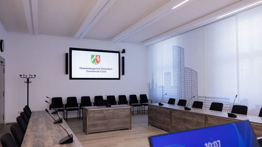 Bereits in vielen deutschen Gerichten ist es - wie hier am Oberlandesgericht Düsseldorf - üblich, Großildschirme zu nutzen, um B